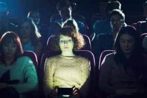 Texting in Movies Light in Face
