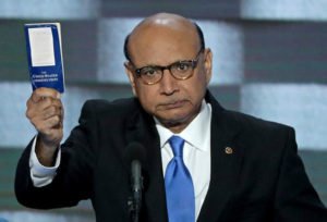 Khizr Khan, father of a deceased Muslim U.S. Captain, holds up a copy of the Constitution as he delivers remarks at the Democratic National Convention.