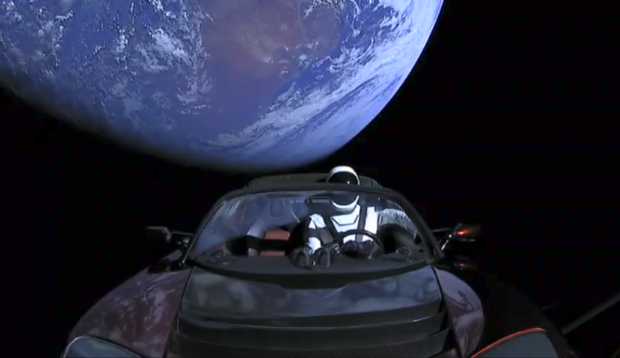 Star Man Tesla Roadster above Earth