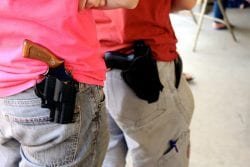 Open carry holsters and handguns