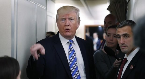Donald Trump answers press questions aboard Air Force One