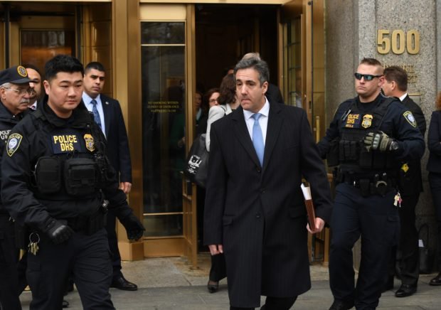 US President Donald Trumps former attorney Michael Cohen leaves US Federal Court in New York on December 12, 2018 after his sentencing after pleading guilty to tax evasion, making false statements to a financial institution, illegal campaign contributions, and making false statements to Congress. - US President Donald Trump's former lawyer Michael Cohen delivered a blistering attack on his former boss as he was sentenced to three years in prison on December 12, 2018 for multiple crimes. "It was my duty to cover up his dirty deeds," Cohen said as he pleaded for leniency before US District Judge William H. Pauley III.Cohen, 52, said he was taking responsiblity for his crimes "including those implicating the President of the United States of America." (Photo by TIMOTHY A. CLARY/AFP/Getty Images)