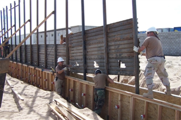 Arkansas National Guard building a wall (Department of Defense photo) https://media.defense.gov/2006/Oct/06/2001245115/-1/-1/0/619868-U-NEX55-011.jpg