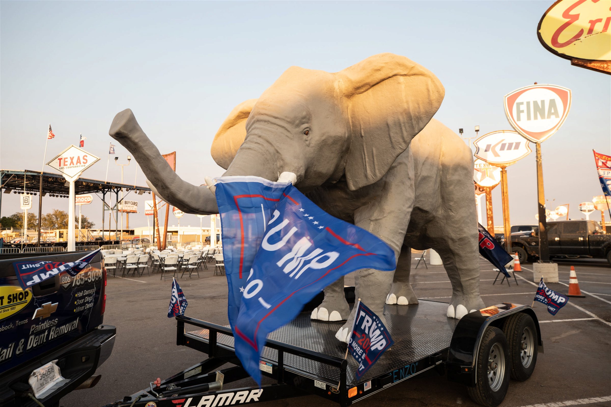 A truck pulled a large elephant on a trailer with multiple Trump flags attached during a "Trump Train" car parade in Lubbock, Texas, on Sunday, Oct. 18, 2020. (Kaylee Greenlee - DCNF)