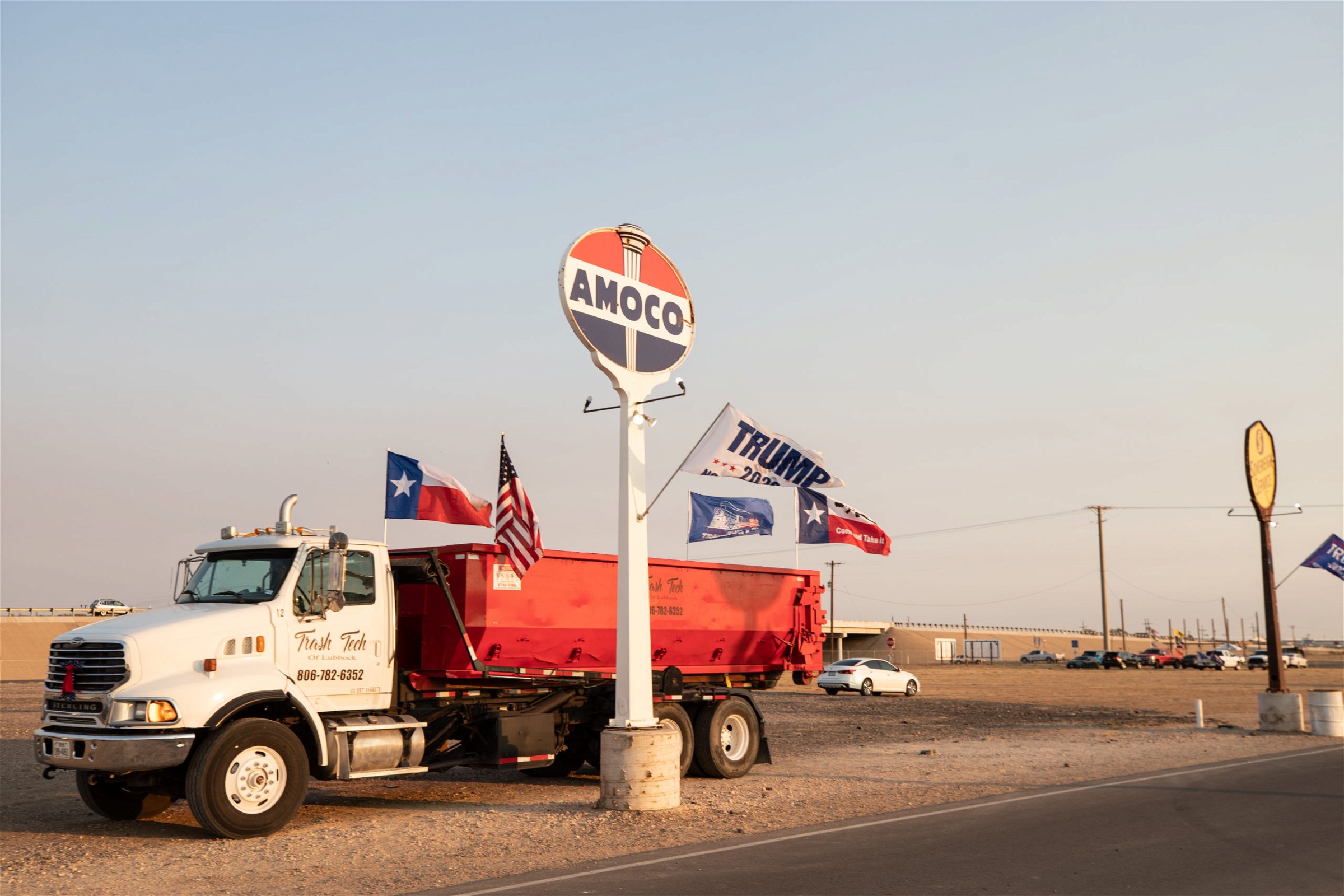 A truck with Texas, American, and "Trump train" flags returned to Cook's Garage after a "Trump Train" car parade in Lubbock, Texas, on Sunday, Oct. 18, 2020. (Kaylee Greenlee - DCNF)