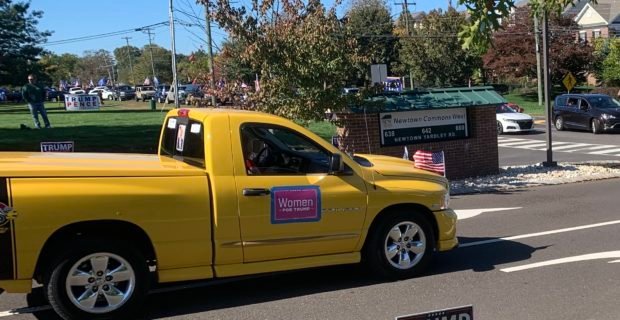 A vehicle with ‘Women For Trump’ sign follows the parade route in Newtown, Pennsylvania, on Oct. 17, 2020. (Bernadette Breslin / Daily Caller News Foundation)
