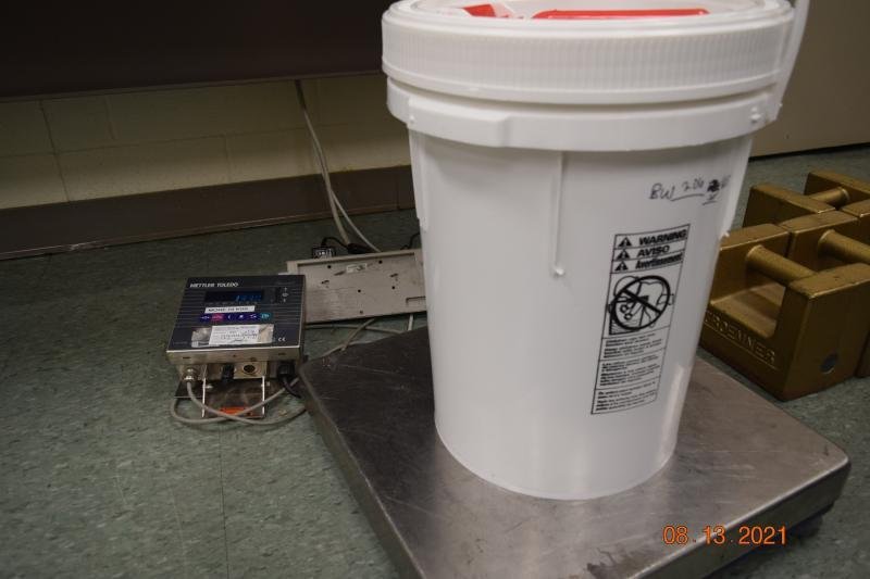 CBP officers at Brownsville Port of Entry seized more than 13 pounds of fentanyl hidden in a passenger vehicle and placed it into this plastic container.