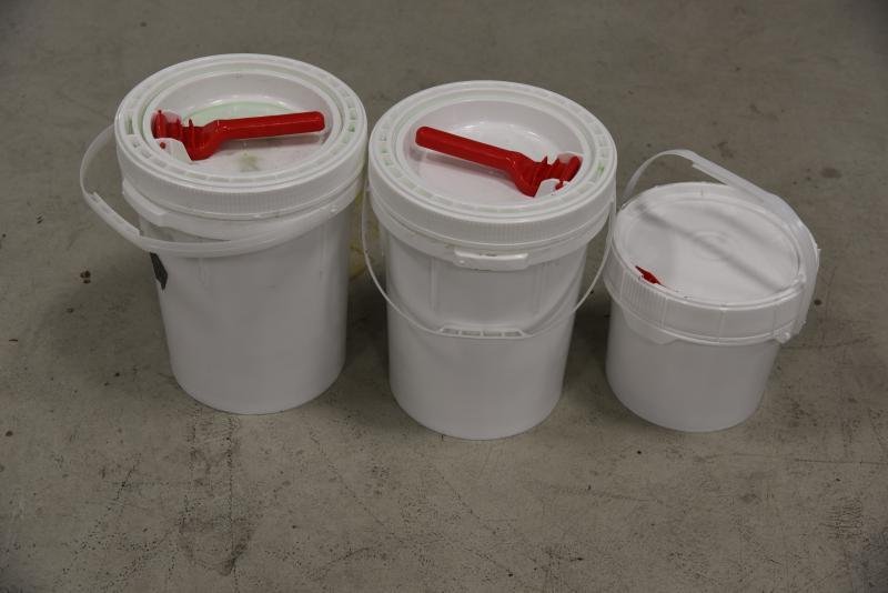 Containers filled with 56.39 pounds of methamphetamine hidden within a vehicle.